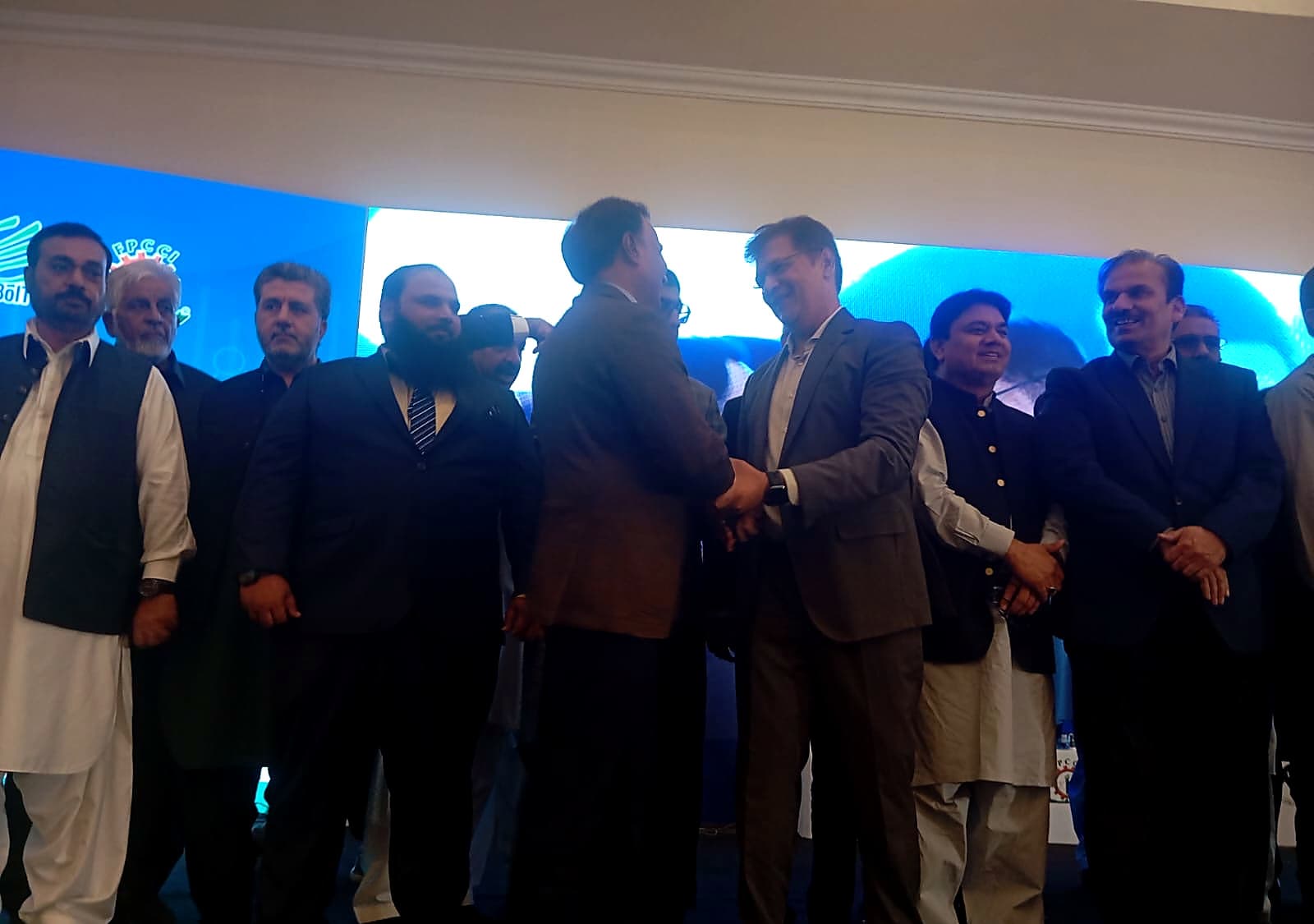 Delegates greeting one another at the Balochistan Economic and Investment Forum 2026.